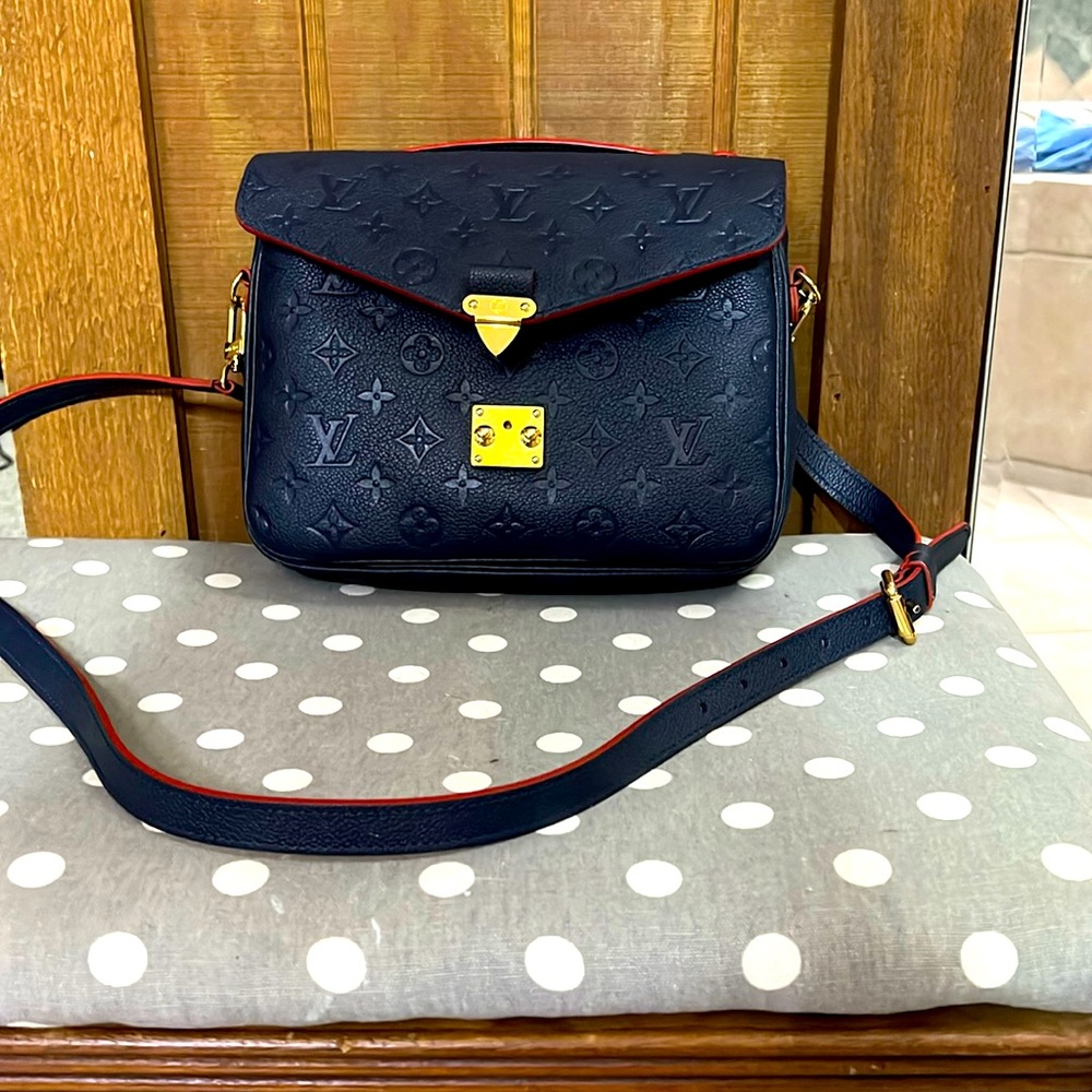 Louis Vuitton purse that is just too small for me.